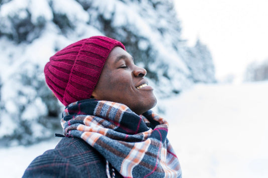 Man outside in the winter after using Elixir Mind Body Botanicals Support Massage + Body Oil to boost his immune system