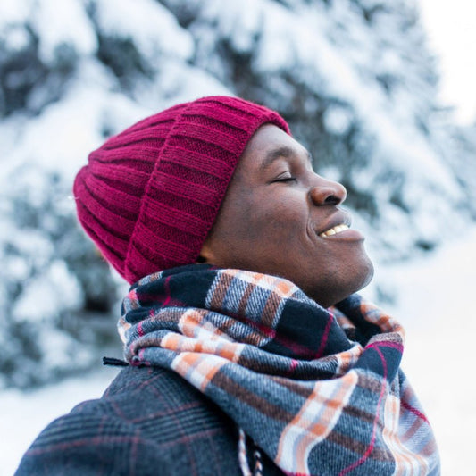 Man outside in the winter after using Elixir Mind Body Botanicals Support Massage + Body Oil to boost his immune system