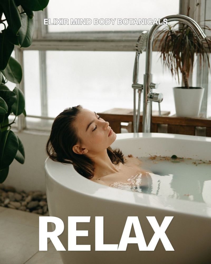 Woman relaxing in a tub using Elixir Mind Body Botanicals Relaxation formulations available at Elixir Mind Body Boutique