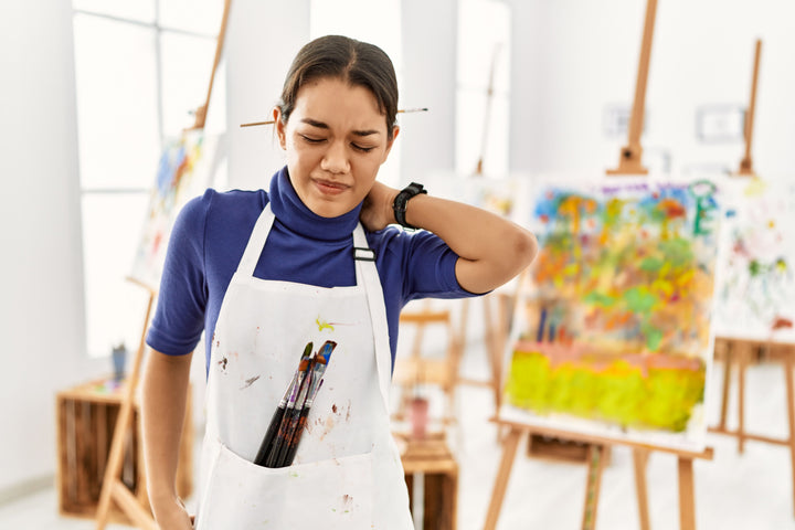 Female art teacher that has a sore neck and could benefit from using Elixir Mind Body Botanicals Relief Balm