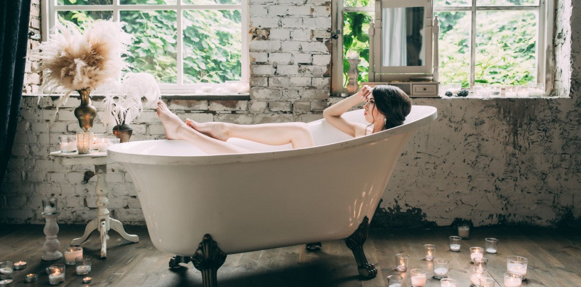 woman relaxing in clawfoot tub