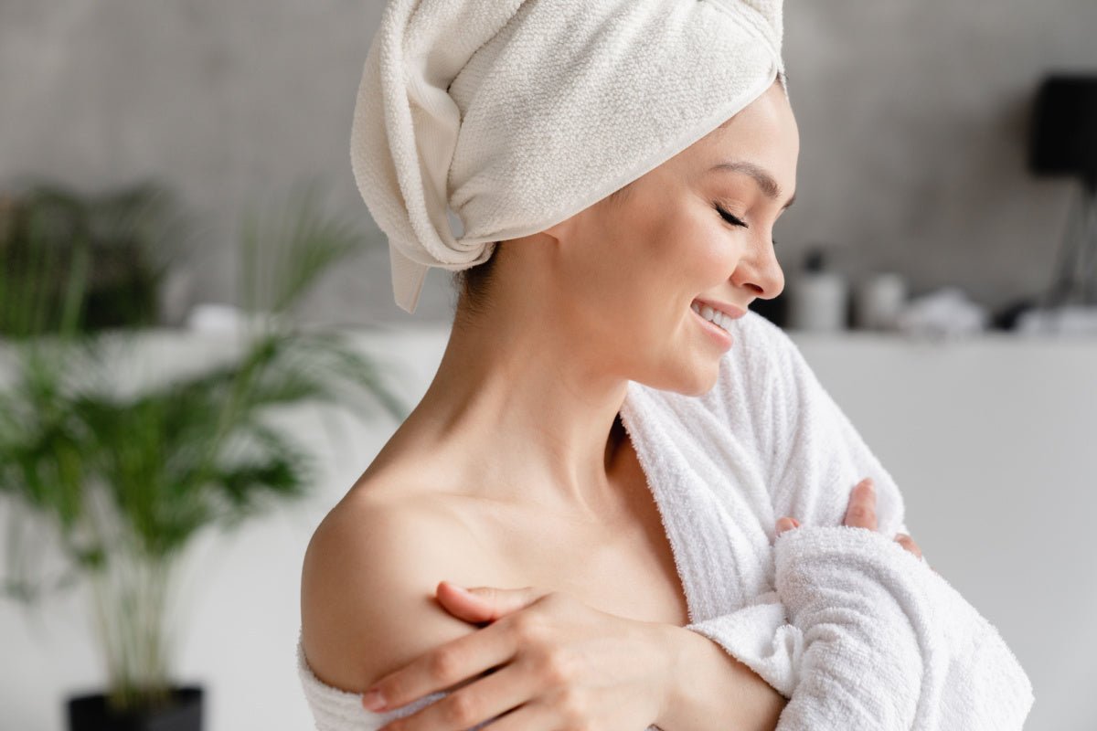 Woman with soft skin after using Elixir Mind Body Botanicals Massage + Body Oils from Elixir Mind Body Boutique