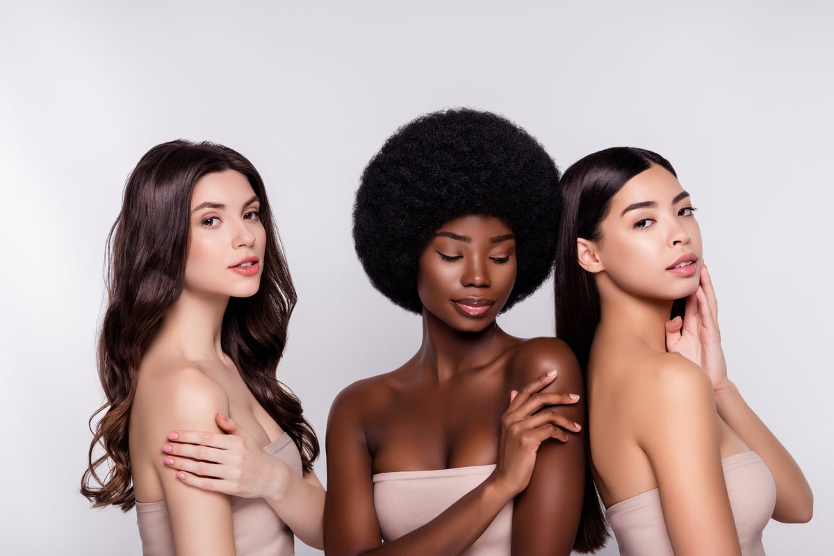 Three women with soft, silky skin after using Elixir Mind Body Botanicals Radiant Massage + Body Oil from Elixir Boutique
