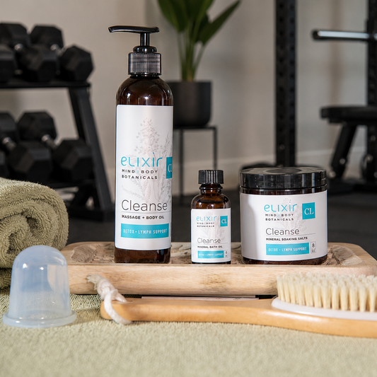 Elixir Cleanse products on a towel with gym equipment in the background