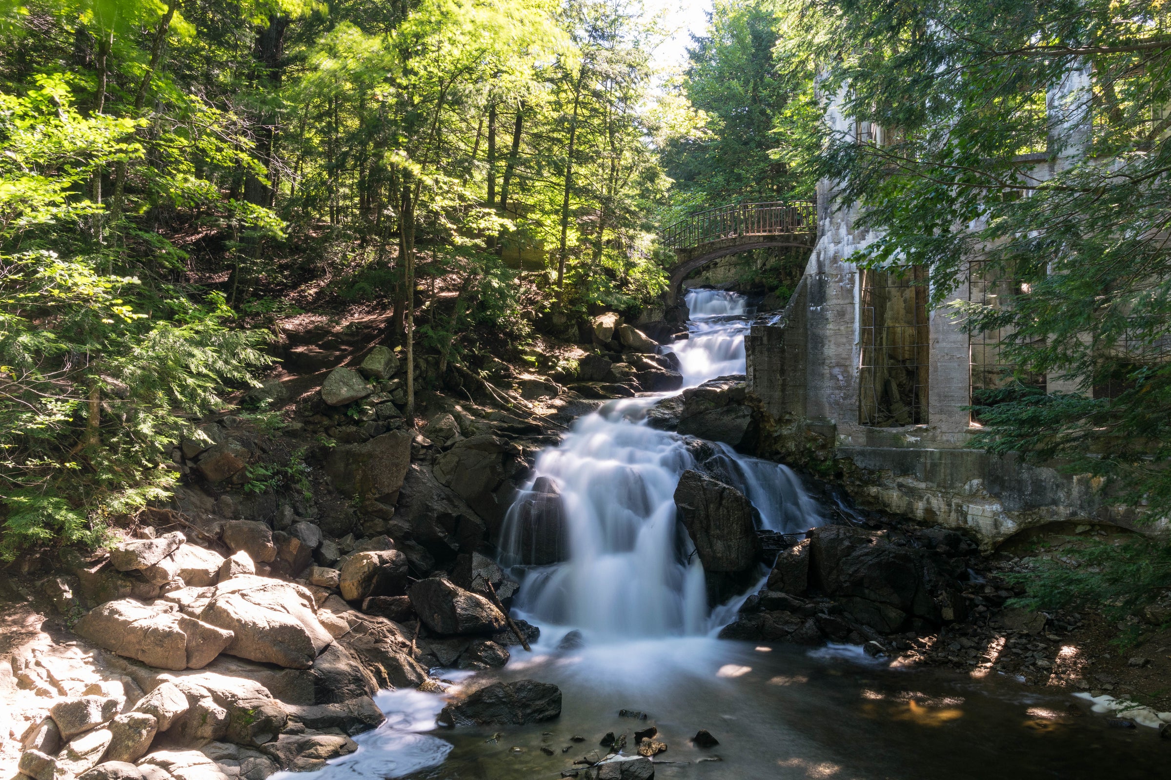 Outdoor photo of a waterfall flowing over rocks.