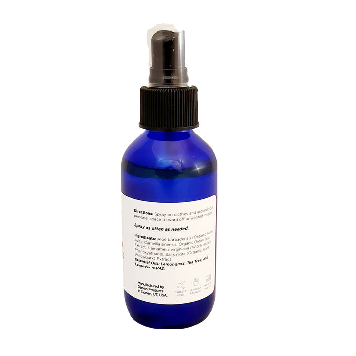 Blue spray bottle showing the back side of the Elixir Mind Body Botanicals Bug Away Mist with directions and ingredients. 