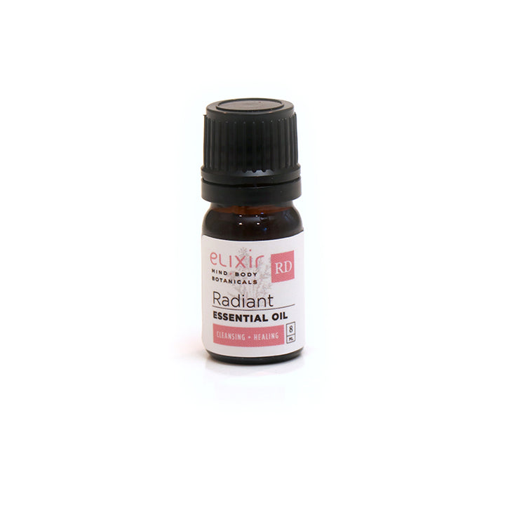 A small bottle of Elixir Mind Body Botanicals Radiant Essential Oil on a white background