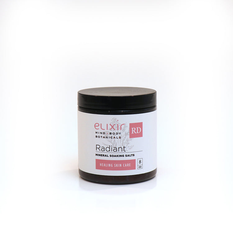 A jar of Elixir Mind Body Botanicals Radiant Mineral Soaking Salts on a white background