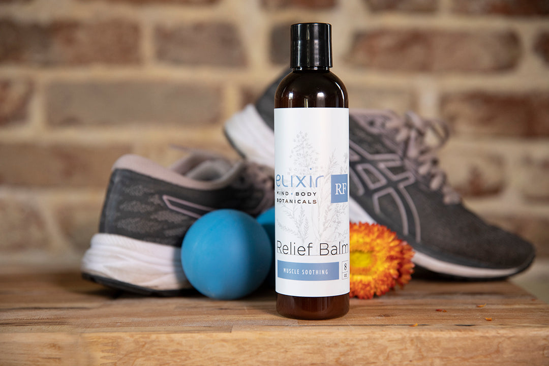 Elixir Mind Body Botanicals Relief Balm with athletic equipment