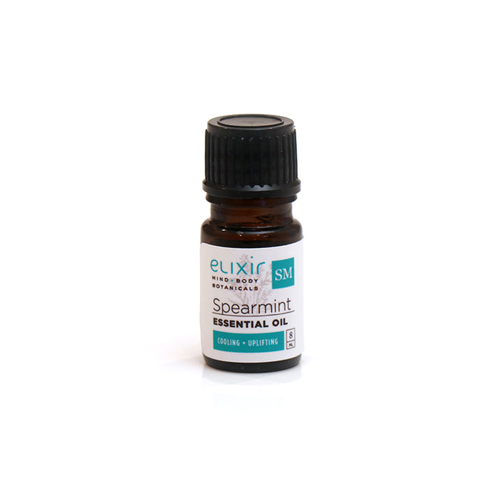 A small bottle of Elixir Mind Body Botanicals Spearmint Essential Oil on a white background