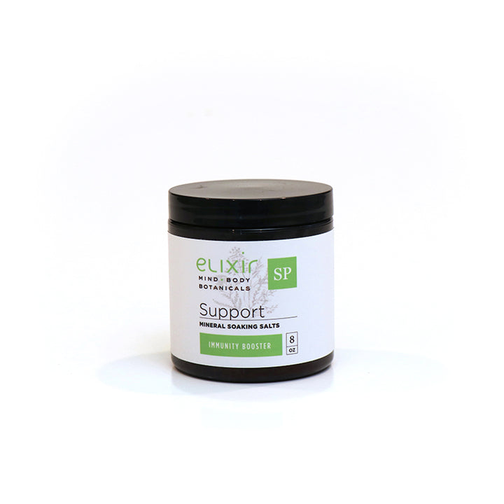 A jar of Elixir Mind Body Botanicals Support Mineral Soaking Salts on a white background