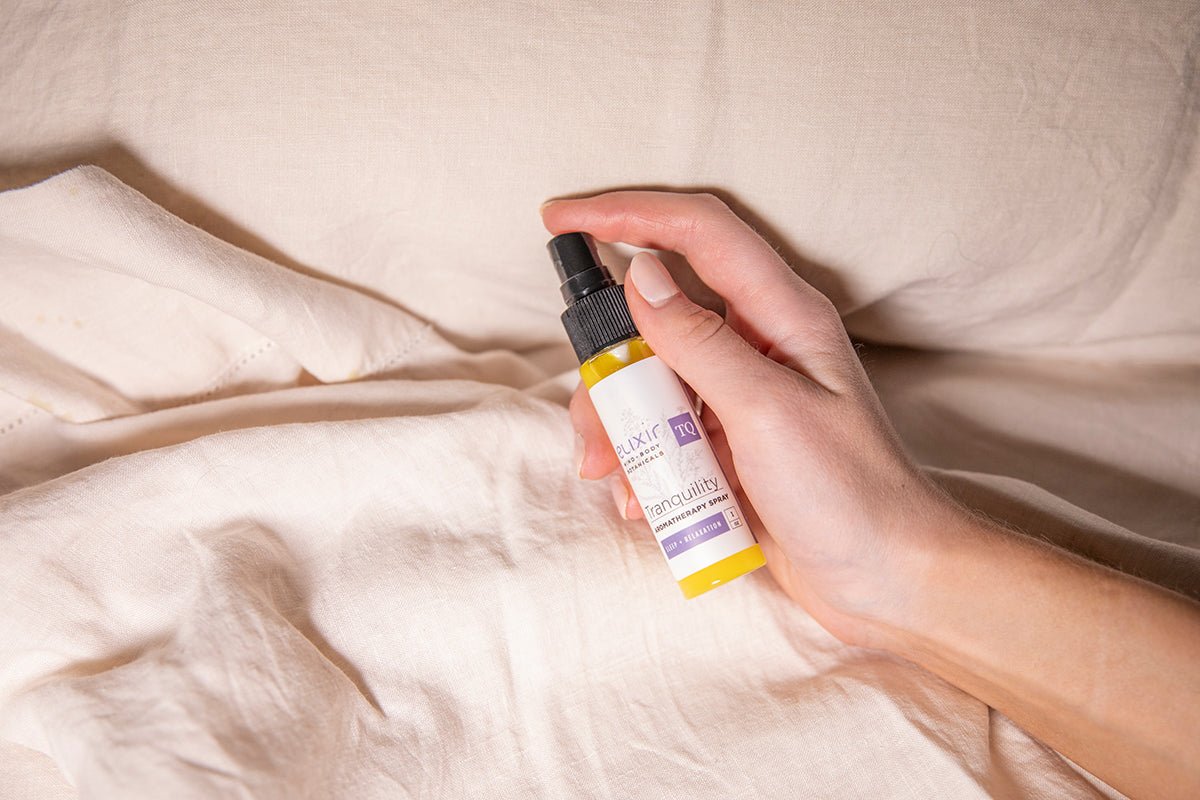 Use Elixir Mind Body Botanicals Aromatherapy Spray to scent your bed linens. Available at Elixir Mind Body Boutique