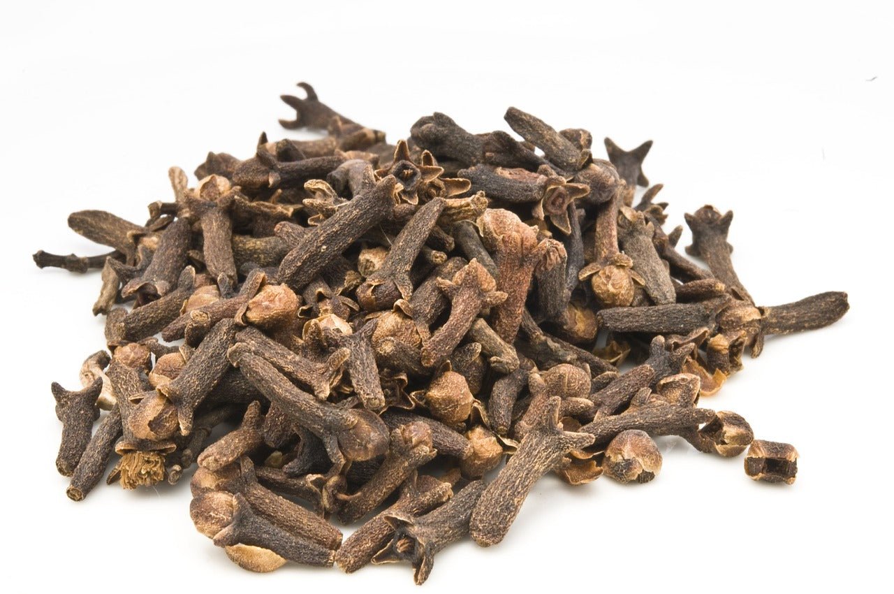 Clove essential oil is used in Elixir Mind Body Botanicals Support Massage + Body Oil at Elixir Mind Body Boutique